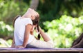 Child doing exercise on platform outdoors. Healthy lifestyle. Yoga girl Royalty Free Stock Photo