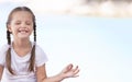 Child doing exercise on platform outdoors. Healthy lifestyle. Yoga girl Royalty Free Stock Photo