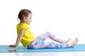 Child doing fitness exercises isolated