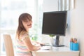 Child doing homework on computer. Online class Royalty Free Stock Photo