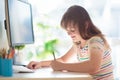 Child doing homework on computer. Online class Royalty Free Stock Photo