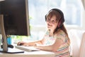 Child doing homework on computer. Online class Royalty Free Stock Photo