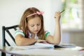 Child doing homework. Kids read and write. Royalty Free Stock Photo