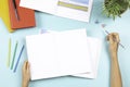 Child doing homework. Top view to desk with open blank notebook, books, colored overlay strips for Dyslexia students Royalty Free Stock Photo