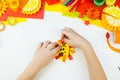 The child is doing paper craft lion the workshop