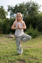 Little beautiful girl doing yoga in the park Royalty Free Stock Photo