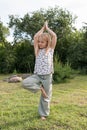 Little beautiful girl doing yoga in the park Royalty Free Stock Photo