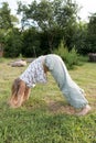 Little beautiful girl doing yoga in the park Royalty Free Stock Photo