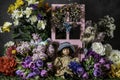 Child doll surrounded by flowers and butterflies