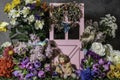 Child doll surrounded by flowers and butterflies