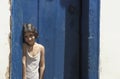 Child at the door of her house in Tiradentes, Minas Gerais, Brazil. Royalty Free Stock Photo