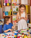 Child dough play in school. Plasticine for children.