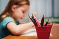 child draw with color crayons