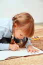 Child draw with colorful crayons