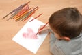 Child draw heart on paper