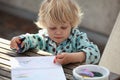 Child drawing an abstract picture