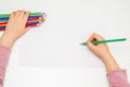 Child is drawing by colored pencils Royalty Free Stock Photo