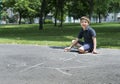 Child drawing family on asphalt Royalty Free Stock Photo