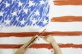 The child drawing the flag of America Royalty Free Stock Photo