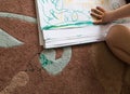 Child Drawing on Paper & Carpet Royalty Free Stock Photo