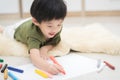 Child drawing picture with crayon Royalty Free Stock Photo