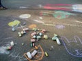 Child drawings on grey asphalt concrete.