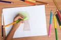 Child draws a pencil drawing of the Tree