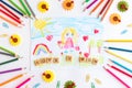 A child draws a postcard for mother's day. Beautiful landscape with mom drawn with pencils. Royalty Free Stock Photo