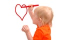 Child draws red pencil a heart Royalty Free Stock Photo