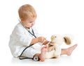 Child dressed as doctor playing with toy Royalty Free Stock Photo