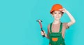 Child dressed as a workman builder. little boy wearing helmet. Portrait little builder in hardhats hammer. Child