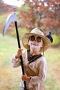 CHild Dressed in Scary Scarecrow Halloween Costume