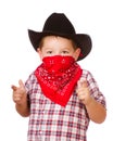 Child dressed up as cowboy playing Royalty Free Stock Photo