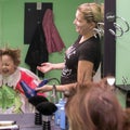 Child dries the hair in a hair salon