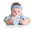 Child drinking from bottle. 8 months old girl. Royalty Free Stock Photo