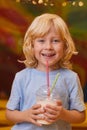 Child drinking milk cocktail Royalty Free Stock Photo