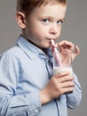 Child drinking milk. Little Boy enjoy milk cocktail Royalty Free Stock Photo