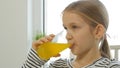 Child Drinking Orange Juice, Kid at Breakfast in Kitchen, Girl Lemon Fresh