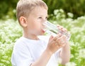 Child drinking pure water Royalty Free Stock Photo