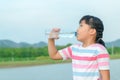 Child drinking pure water in nature Royalty Free Stock Photo