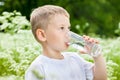 Child drinking pure water Royalty Free Stock Photo