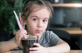 A child drinks a drink from a straw Royalty Free Stock Photo