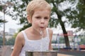 Beautiful little girl drinking water from a fountain Royalty Free Stock Photo