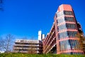 A child drive with his bike in front of the new university building in the city of Siegen, resubmission = 1