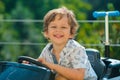 Child Driver. Cute little baby boy pretending to drive. Kid in car with hands on the wheel. Baby Driver. Little kid Royalty Free Stock Photo