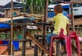 Child driving a Boat Laos Royalty Free Stock Photo