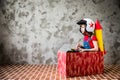 Child driving in a car made of cardboard box