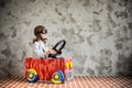 Child driving in a car made of cardboard box