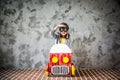 Child driving in a car made of cardboard box Royalty Free Stock Photo