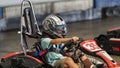 A Child Driving a Go-Kart Circuit